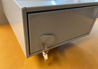Rear view fire rated mail drop slot showing key