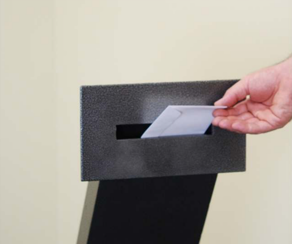 Envelope Drop Through Wall with Electronic Keypad Access envelope being dropped