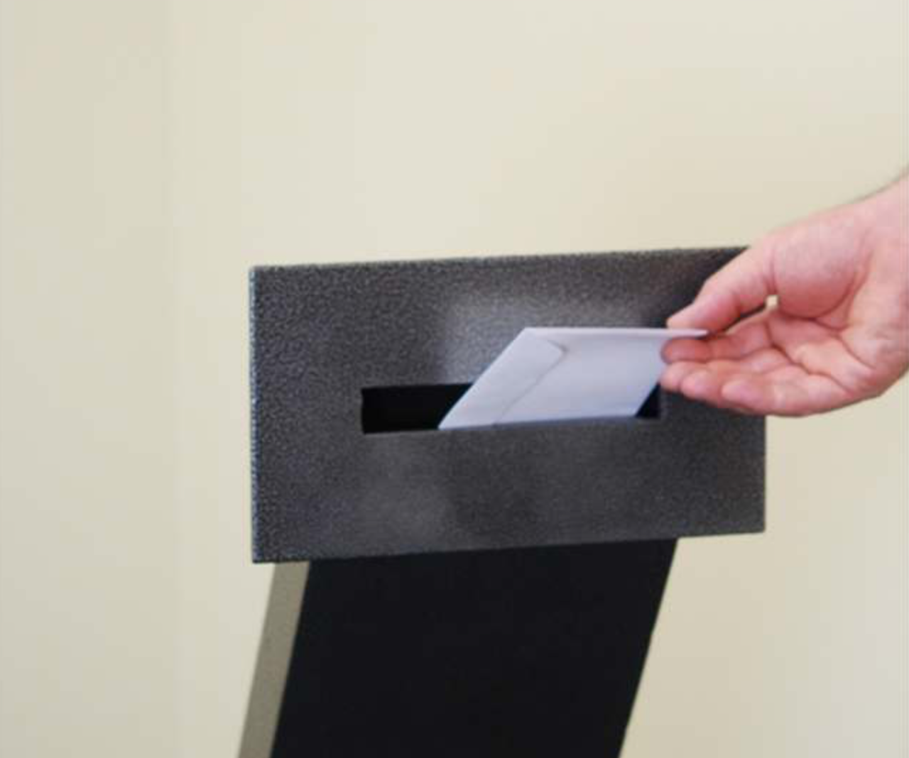 Envelope Drop Through Wall with Electronic Keypad Access envelope being dropped