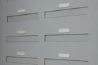 Fire rated though wall mail drop slots