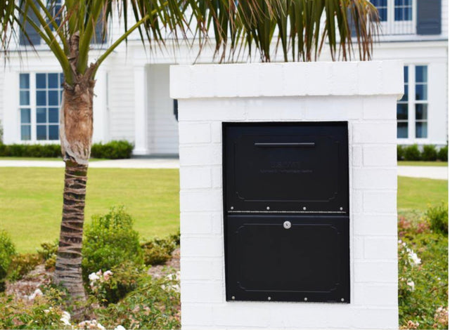 Column locking mailbox built into a white brick column
